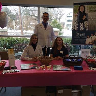 Millersville dentist Doctor Jay McCArl and Kim and Tracy in McCarl Dental Group booth at BWMC Heartbeat for Health event