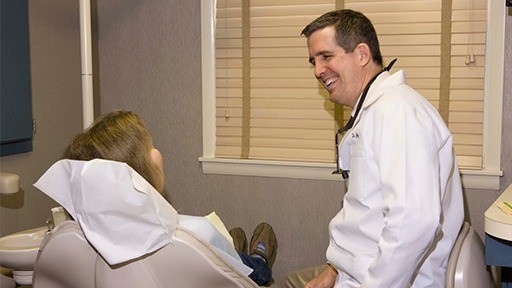 Dr. Jay McCarl smiling at patient