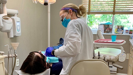 Team member treating dental patient