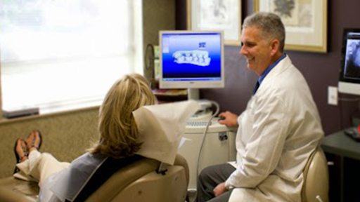 Dr. David smiling at dental patient