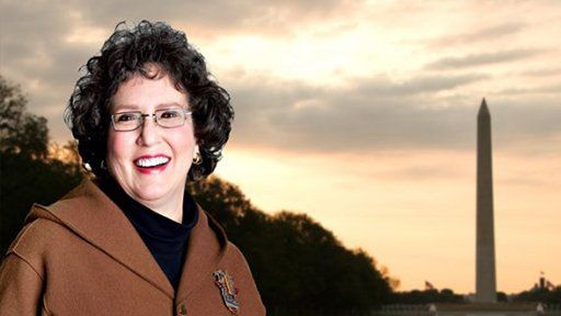 Older woman smiling outdoors