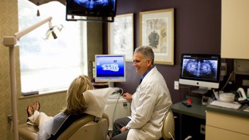 Dr. David smiling at dental patient