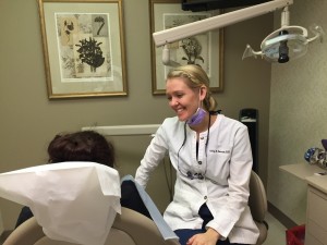 Dental hygienist discussing oral health impact of vaping with dental patient