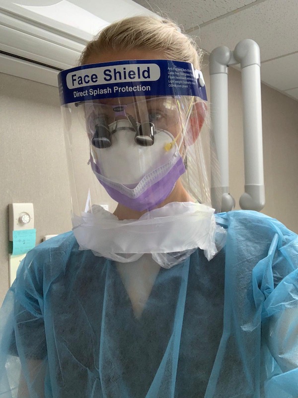 Dental team member wearing personal protective equipment