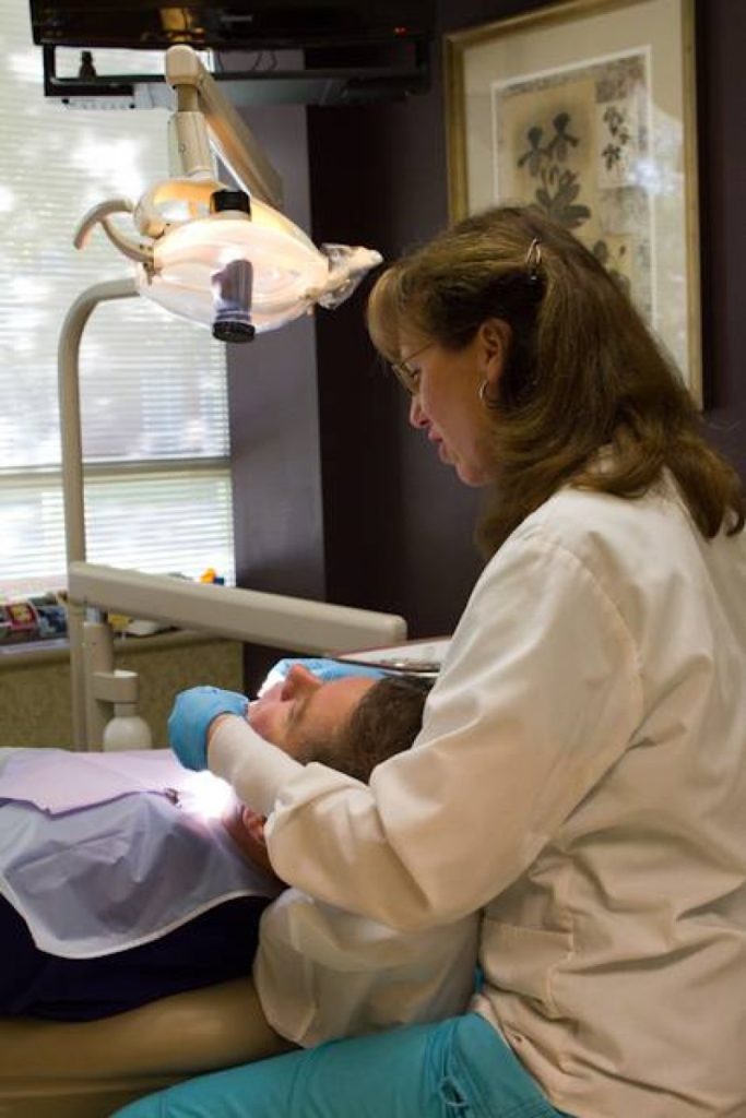 patient learning how to avoid a dry socket