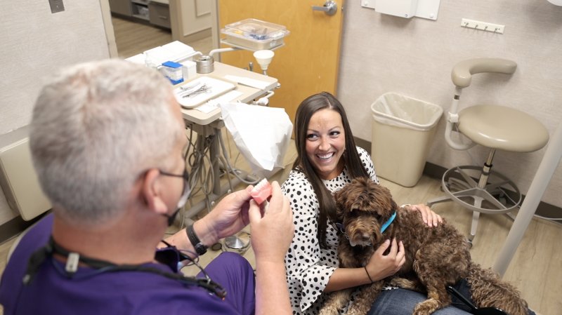 patient holding therapy dog