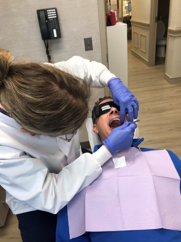 Patient examining chipped tooth